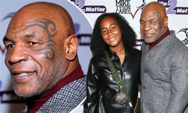 Mike Tyson (R) and daughter Mikey Tyson arrive at the Los Angeles